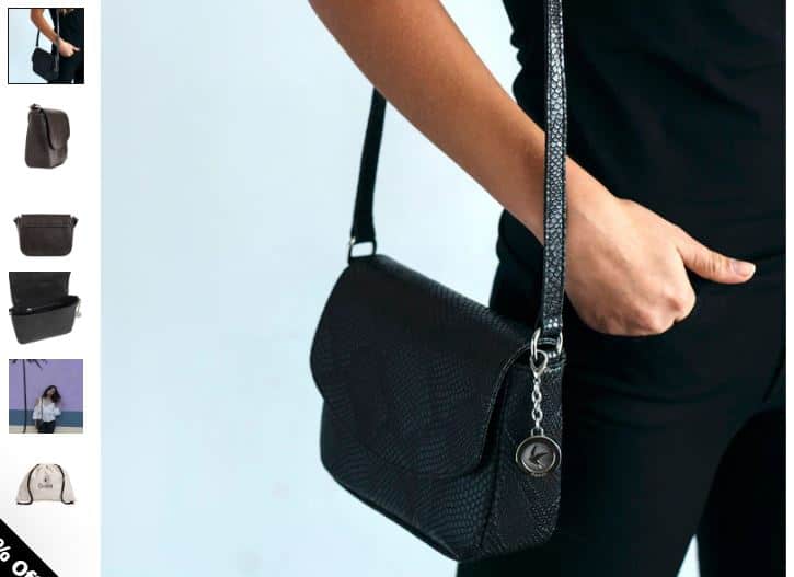 A woman elegantly holds a sleek black purse and a stylish black crossbody bag, showcasing effortless day-to-night fashion.