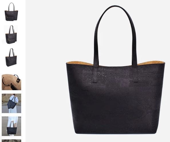 A black tote bag featuring a stylish brown handle, labeled as Zeta Cork Vegan Tote Bag by MURMALI.