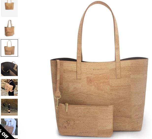 A beige cork tote bag by MURMALI, featuring a wallet and various items arranged inside.